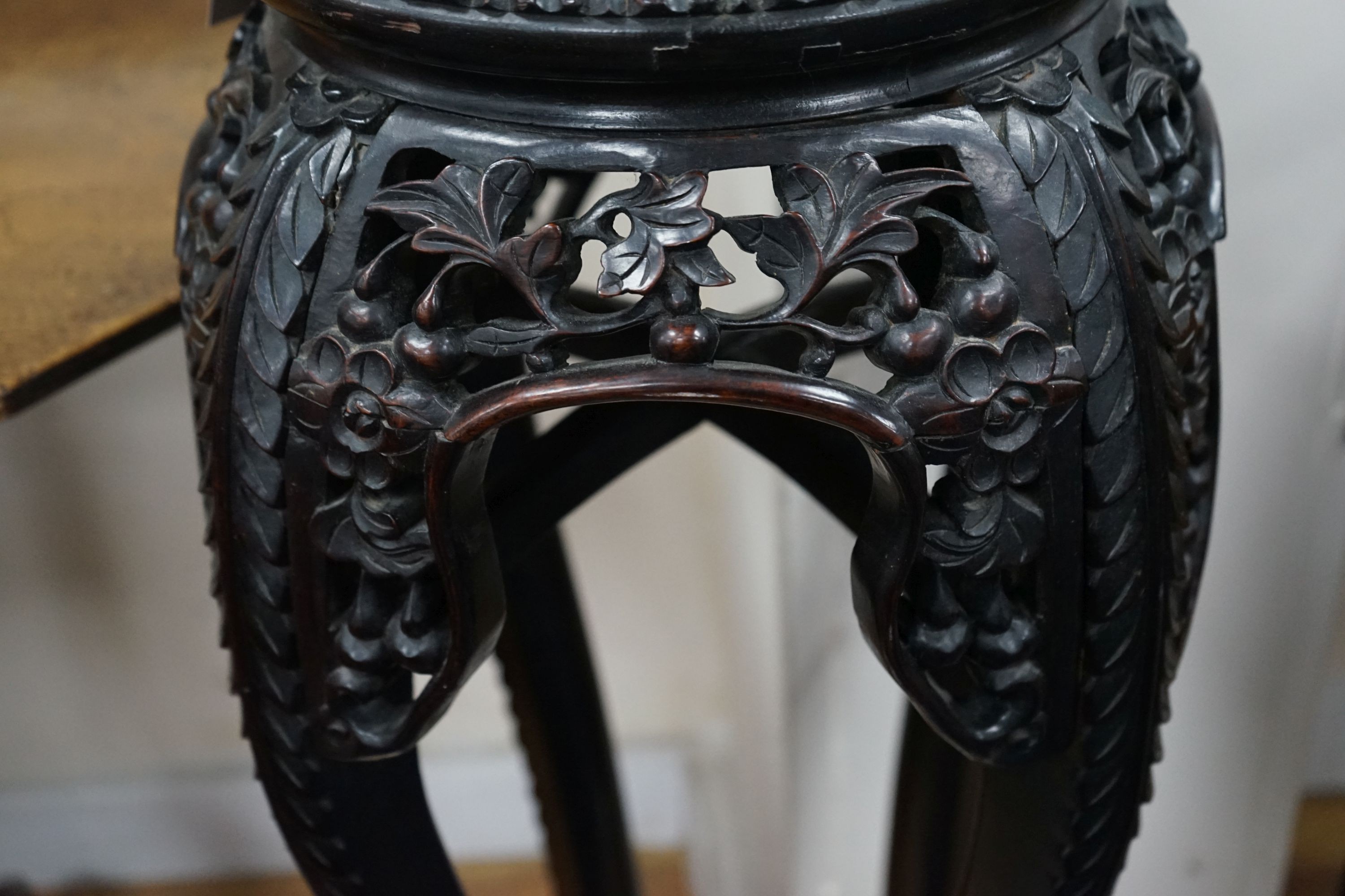 A Chinese circular marble top carved padouk jardiniere stand, height 91cm